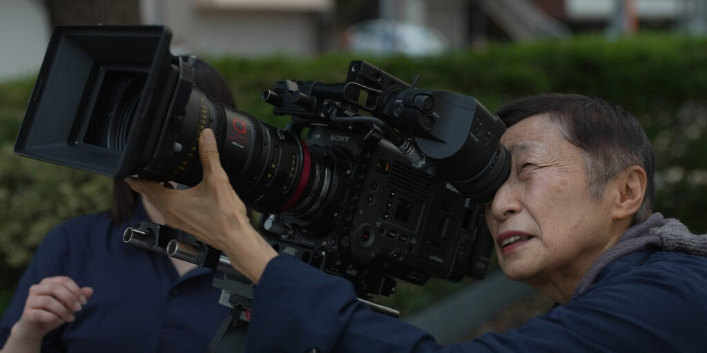 A woman operating a camera