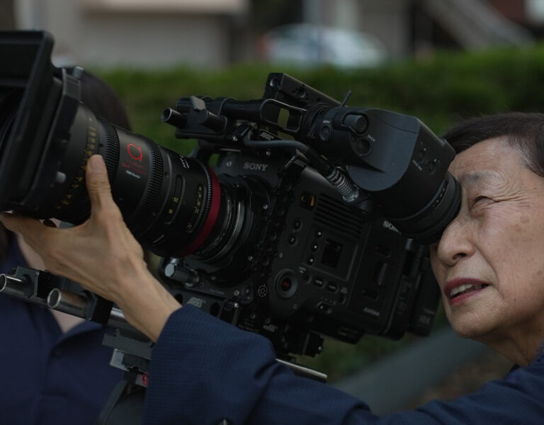 A woman operating a camera