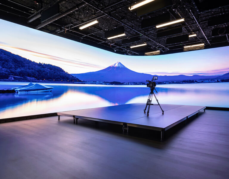 A virtual production wall with a camera