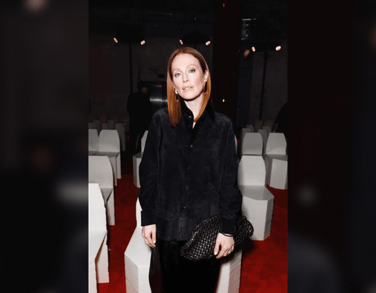 Julianne Moore in a cinema looking into camera