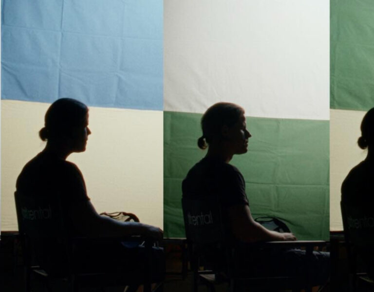 Four silhouetted people against soft lighting