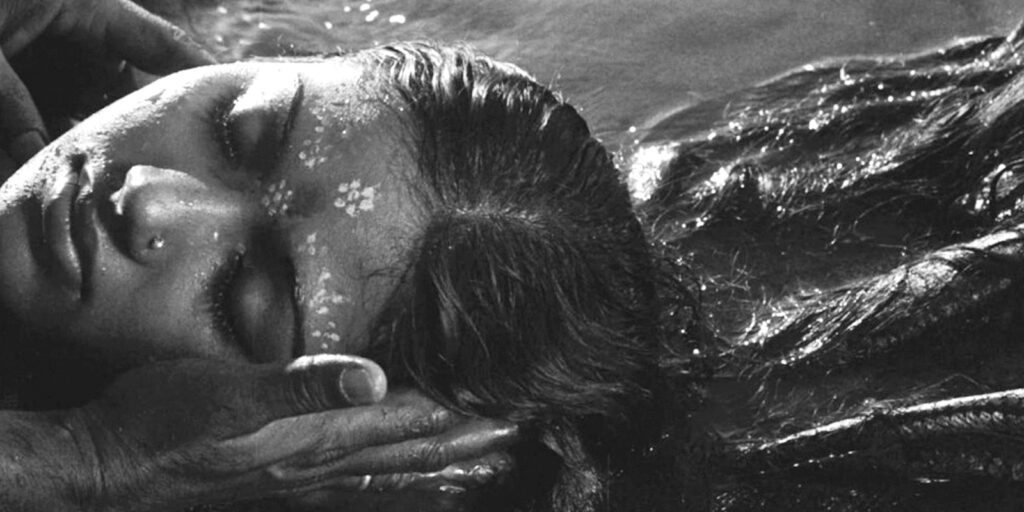 A woman lying in a river
