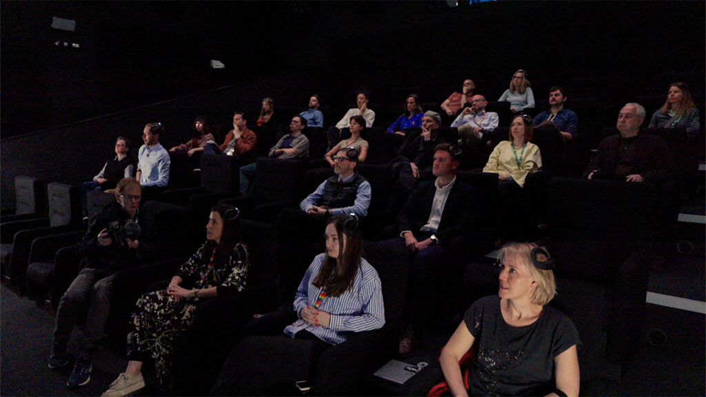 A group of people sat in a cinema