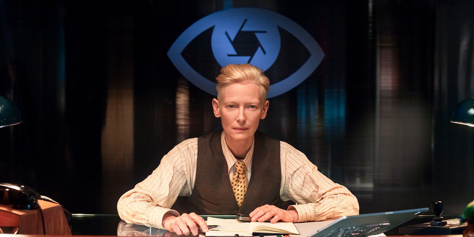 Tilda Swinton sat in a suit