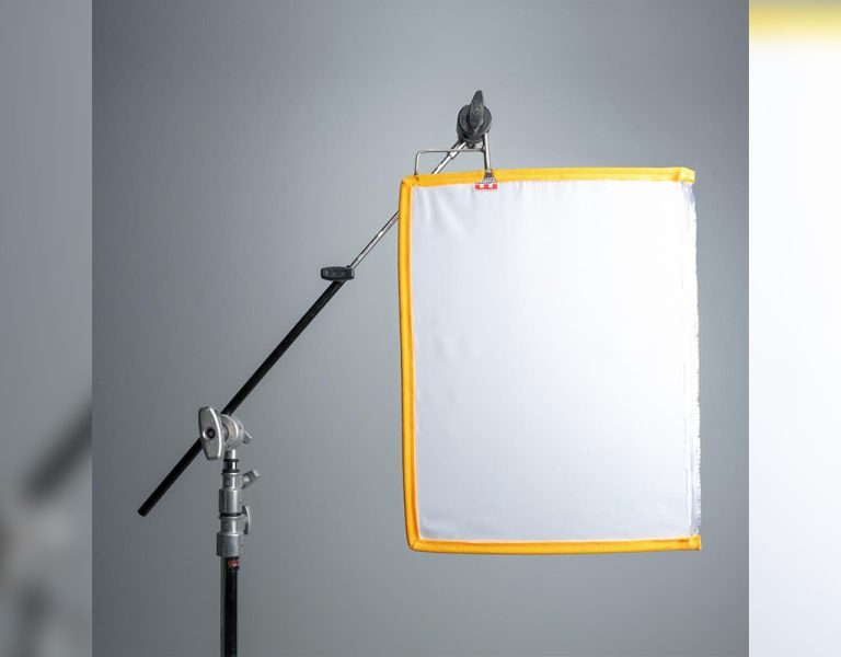 A large light fixture on a grey background