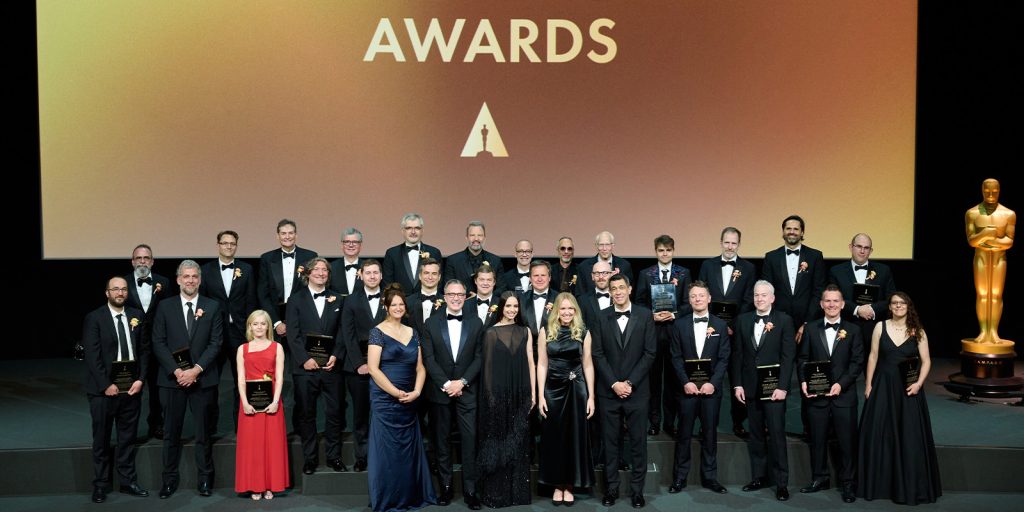 The winners of the Scientific and Technical awards posing on stage 