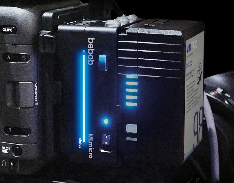 A battery plugged into a camera
