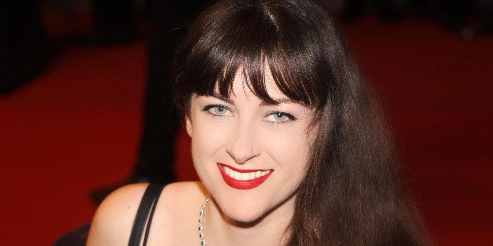 A woman smiling into camera