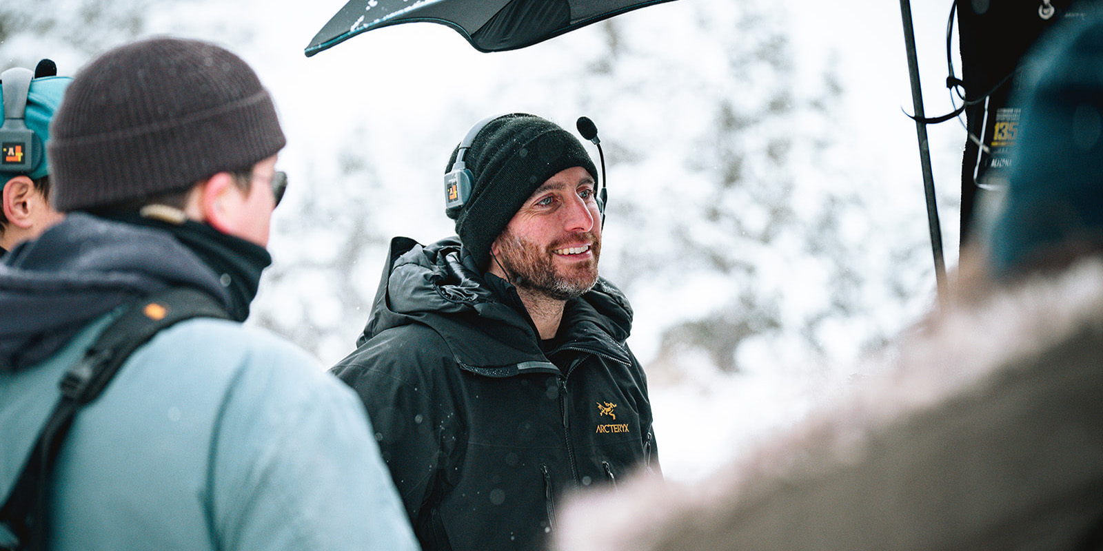 Byron Kopman smiling on set in the snow