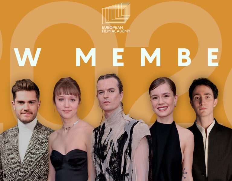 A group of people against a gold background