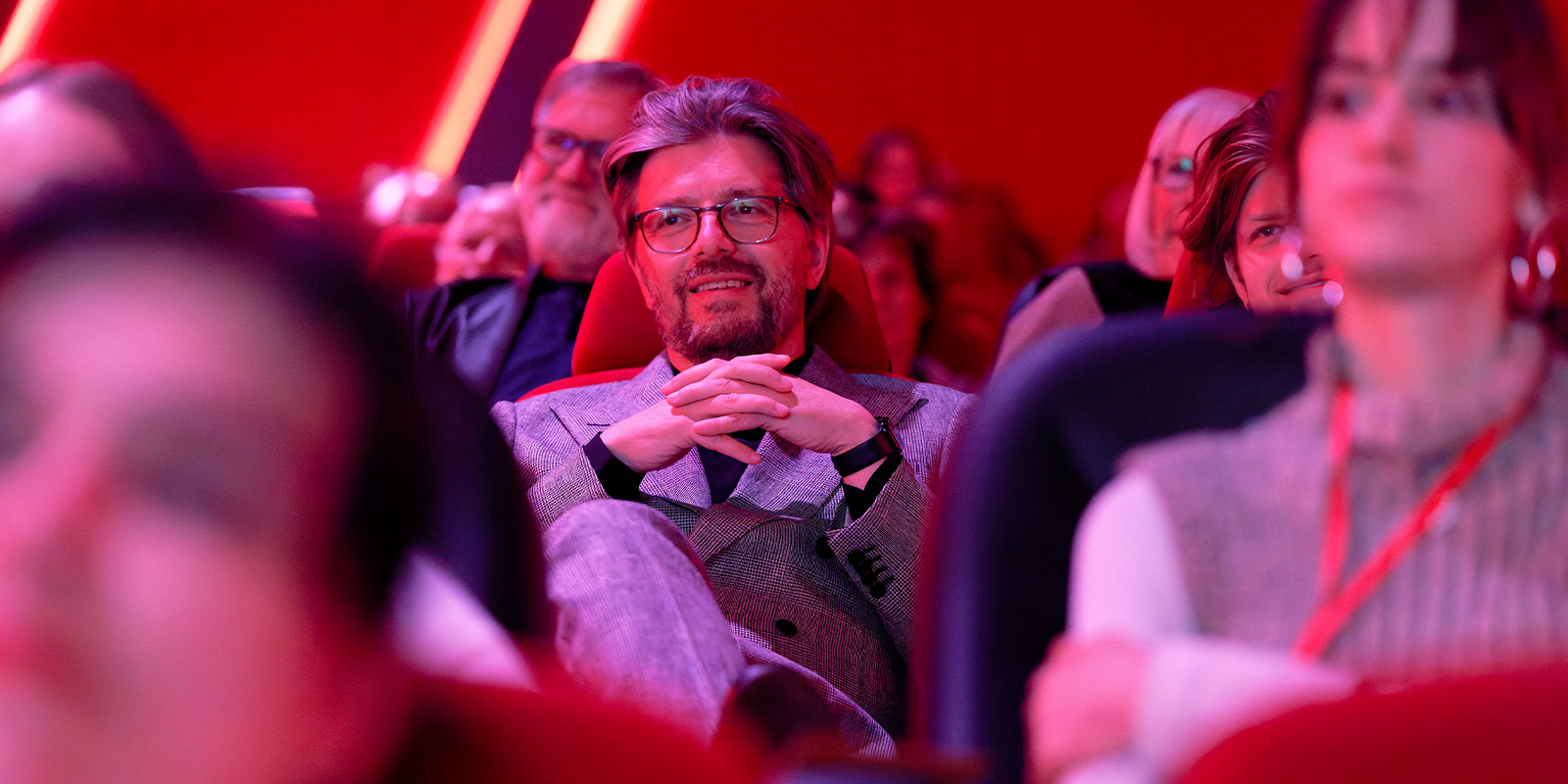 Florian Hoffmeister sat in a cinema smiling