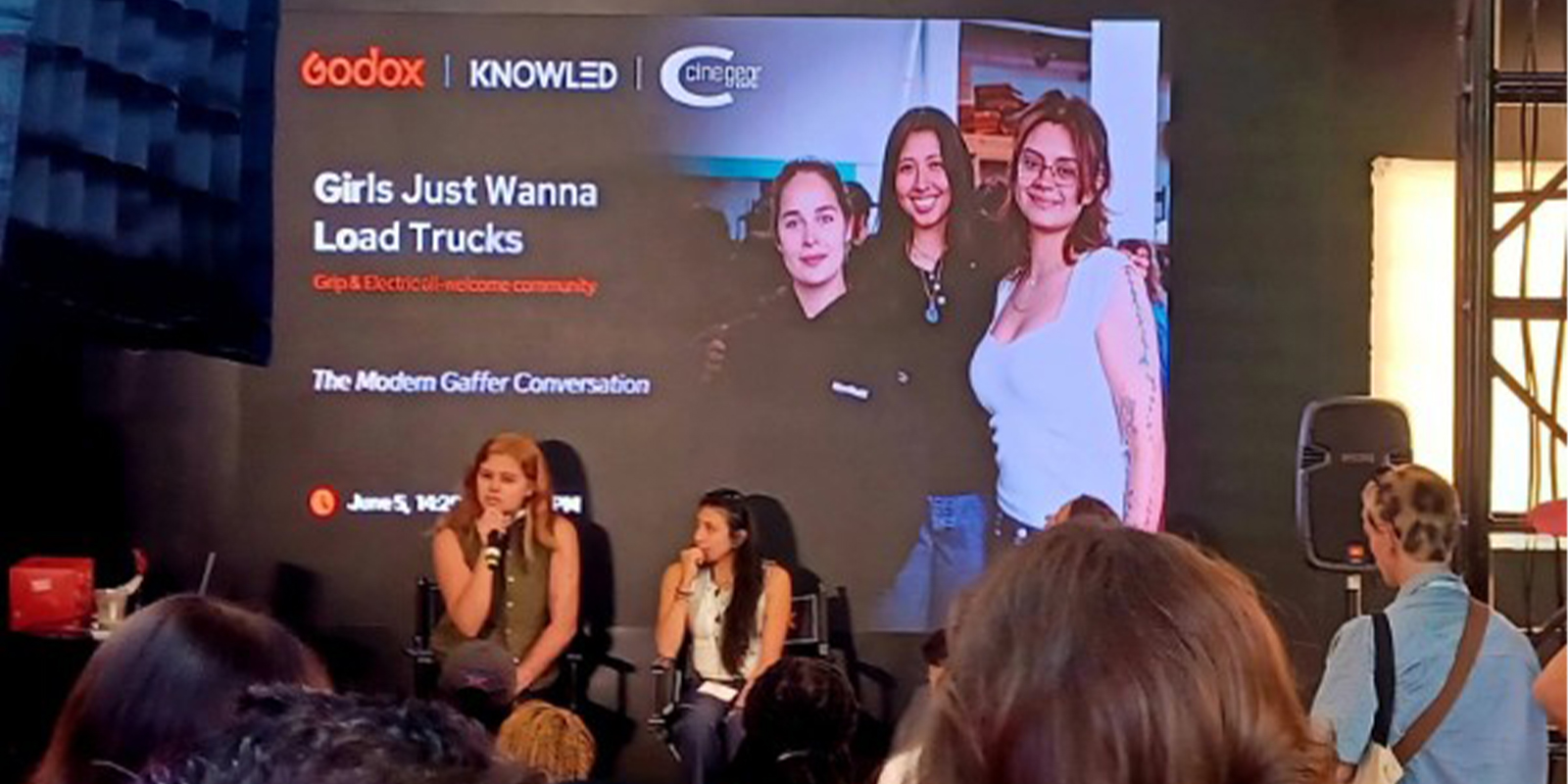 Women talking on a panel