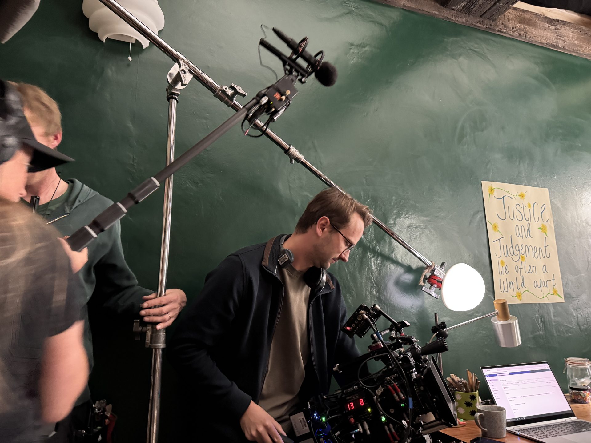 Film crew on set with lighting rigs 
