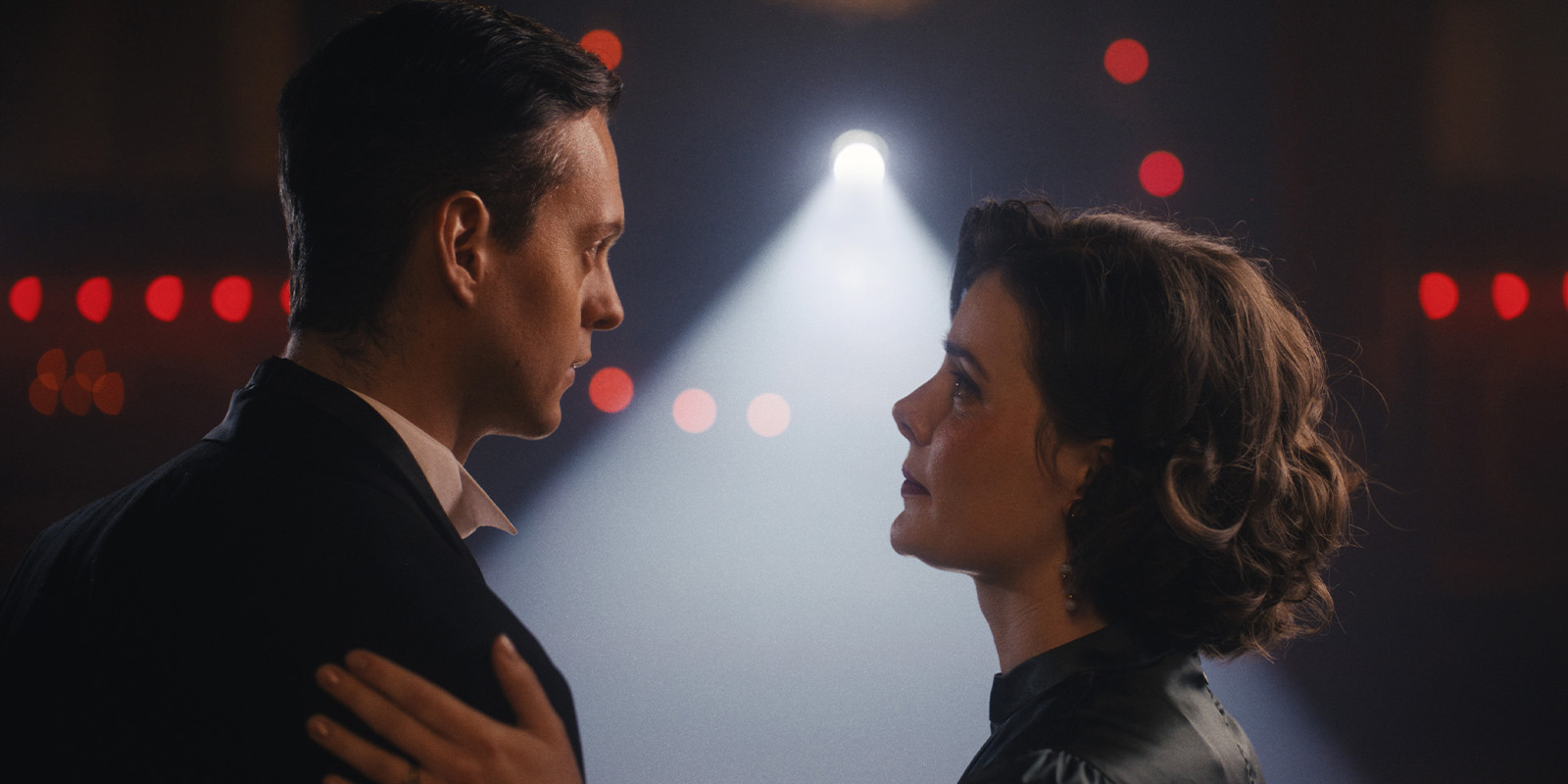 A man and woman looking at each other lovingly