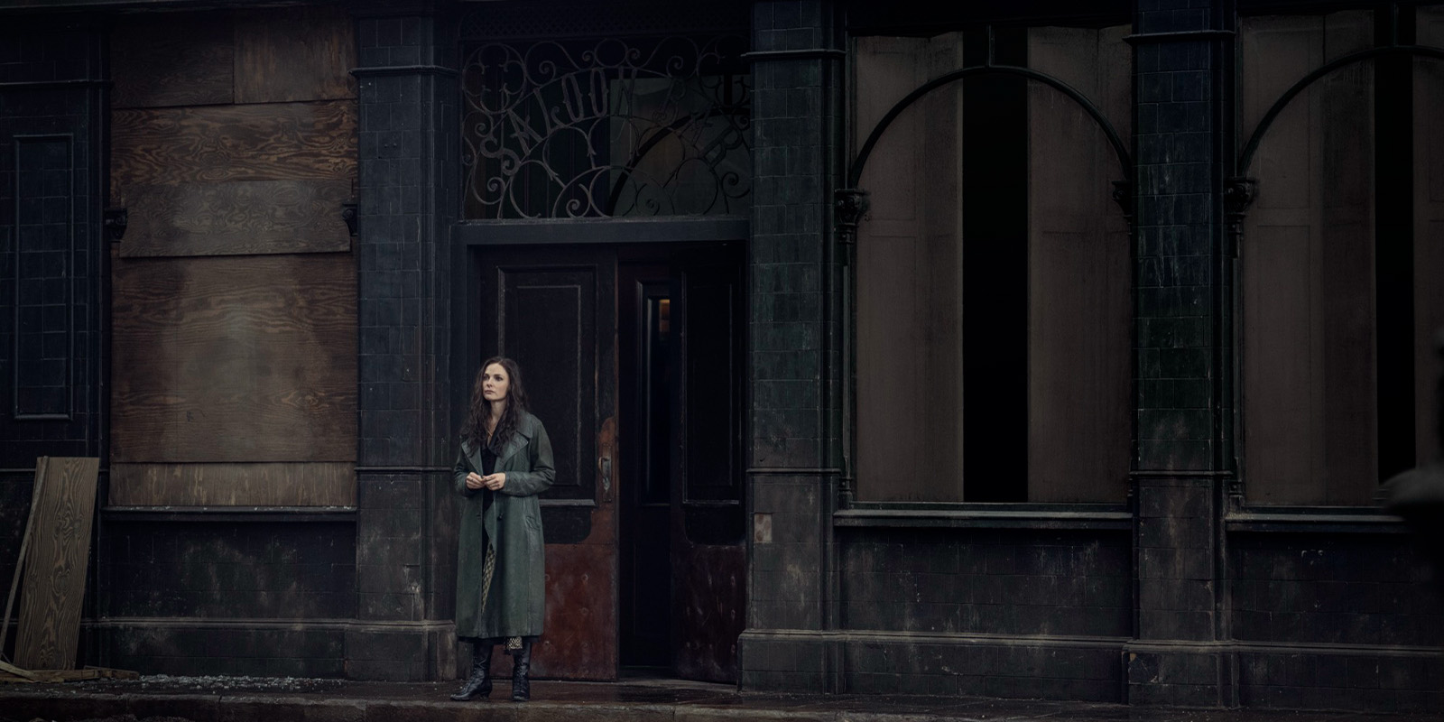 A woman stood outside a pub 
