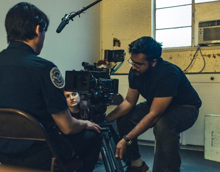 Film crew filming a person in a chair
