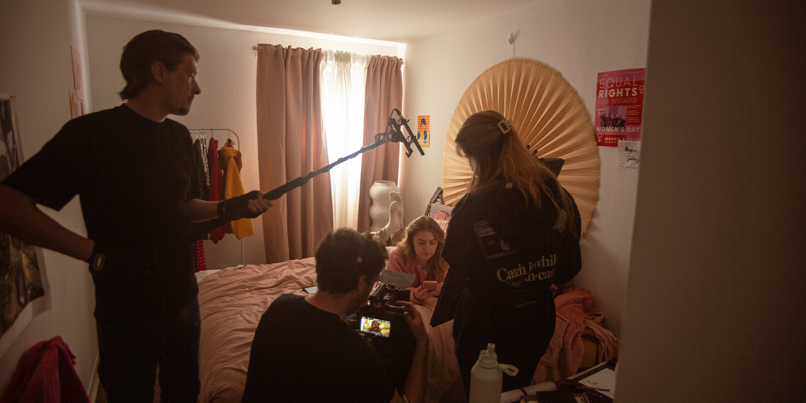 Film crew in a bedroom