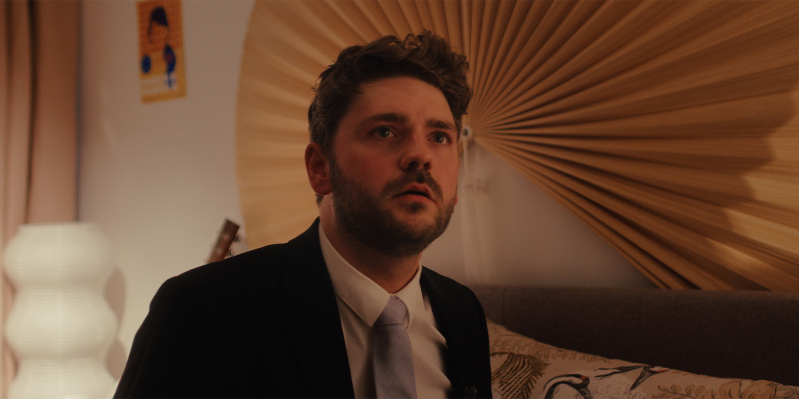 A man in a suit looking concerned