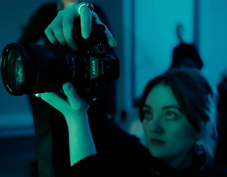 A person operating a camera