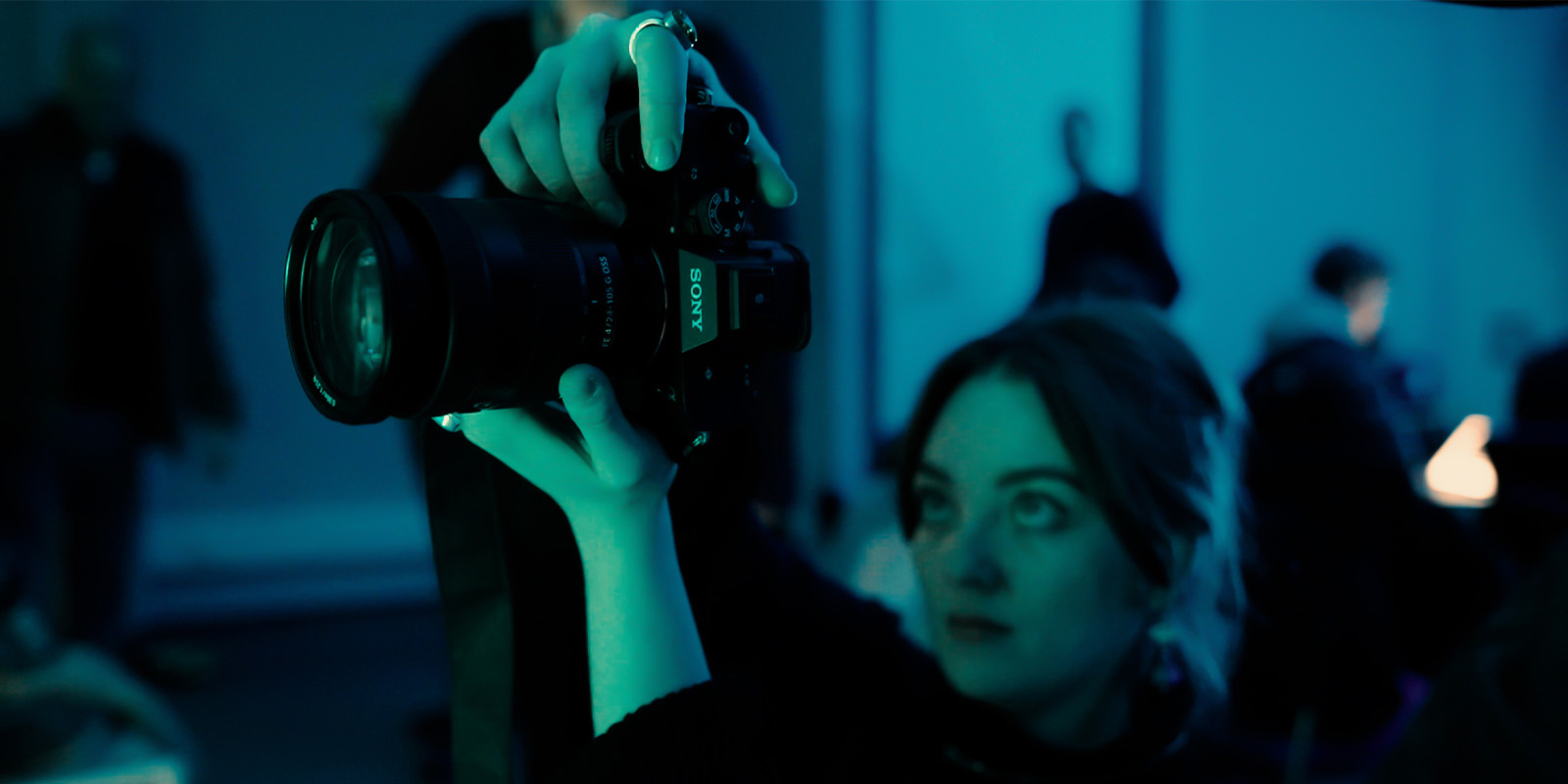 A person operating a camera