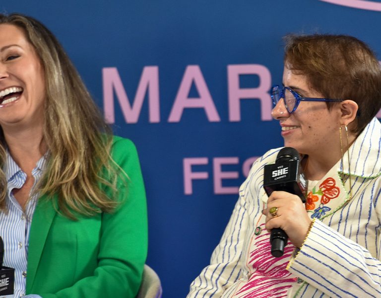 Amanda Toney and Guneet Monga Kapoor at MDF main stage panel laughing together