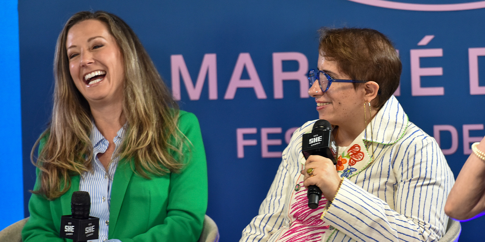 Amanda Toney and Guneet Monga Kapoor at MDF main stage panel laughing together