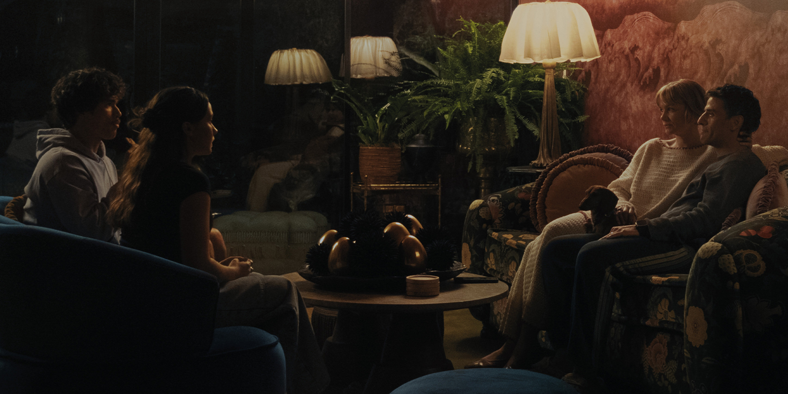 Four people sat talking together 