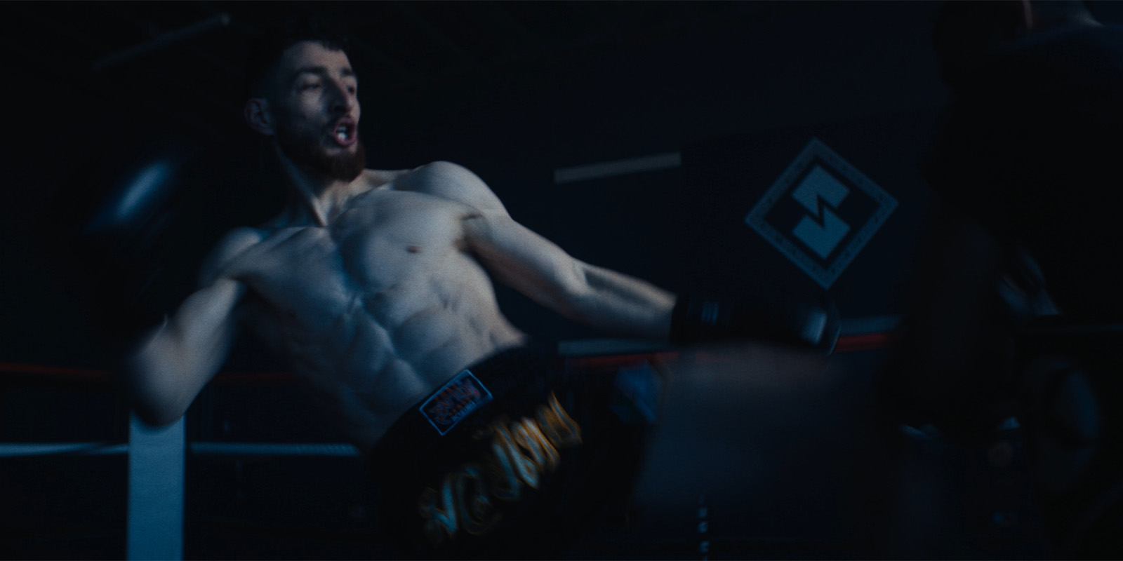 A fighter throwing a kick