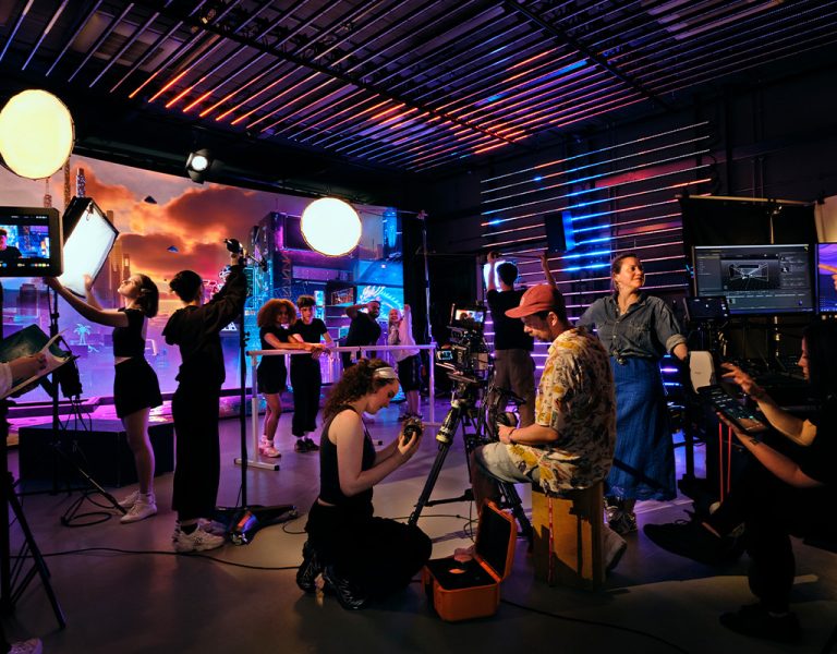 A group of people gathered on a VP set
