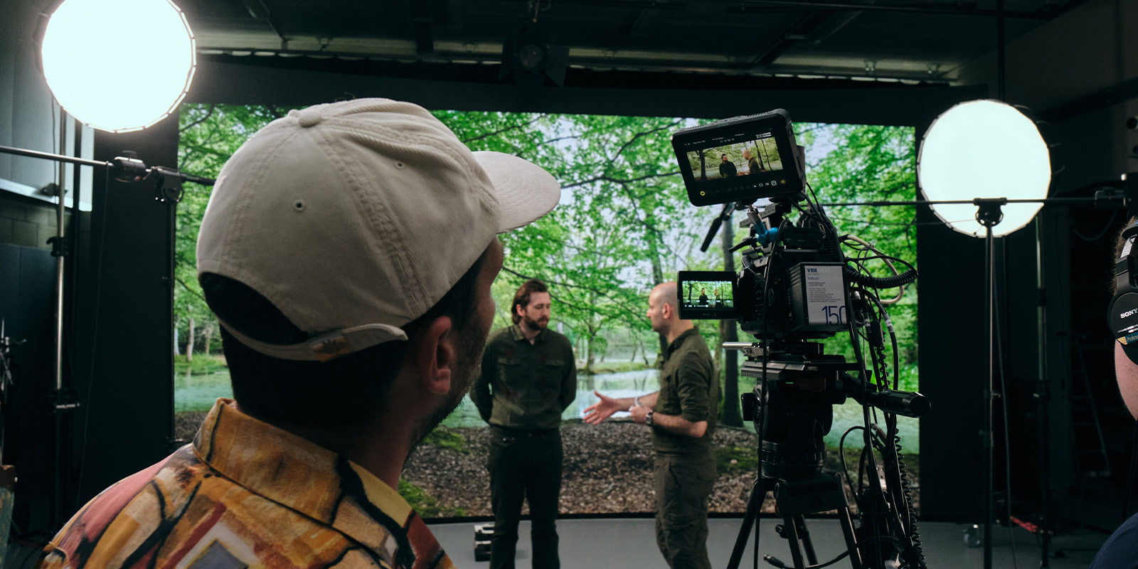 A person filming people on a VP stage
