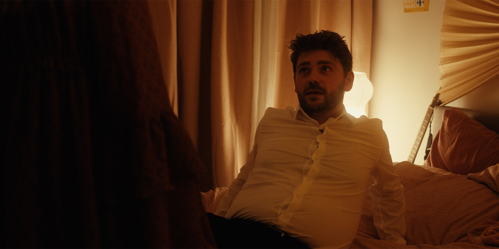 A man lying on a bed