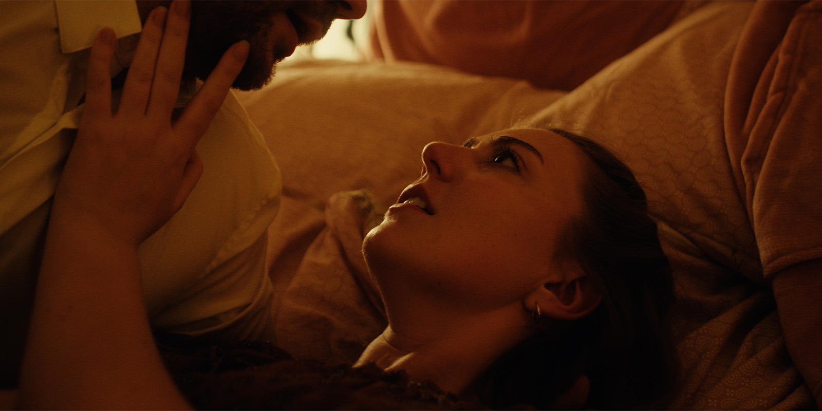 A man and woman lying in bed