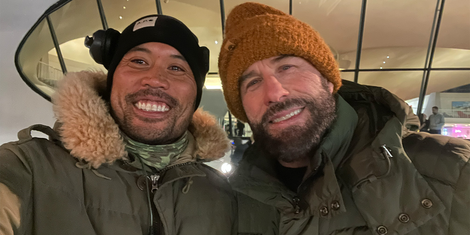 Paul de Lumen and John Travolta smiling in a selfie