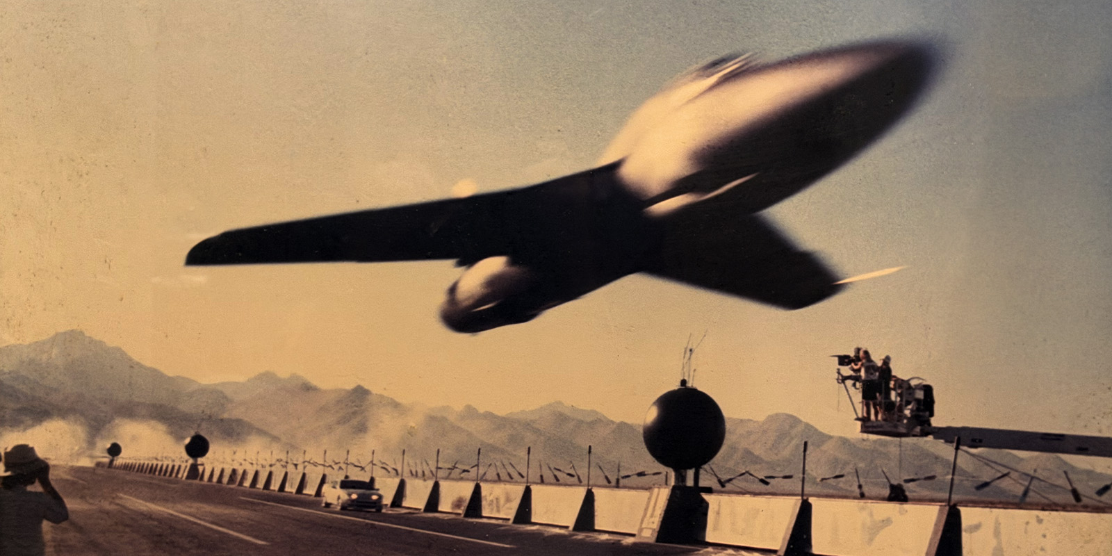 Film crew filming an airplane taking off
