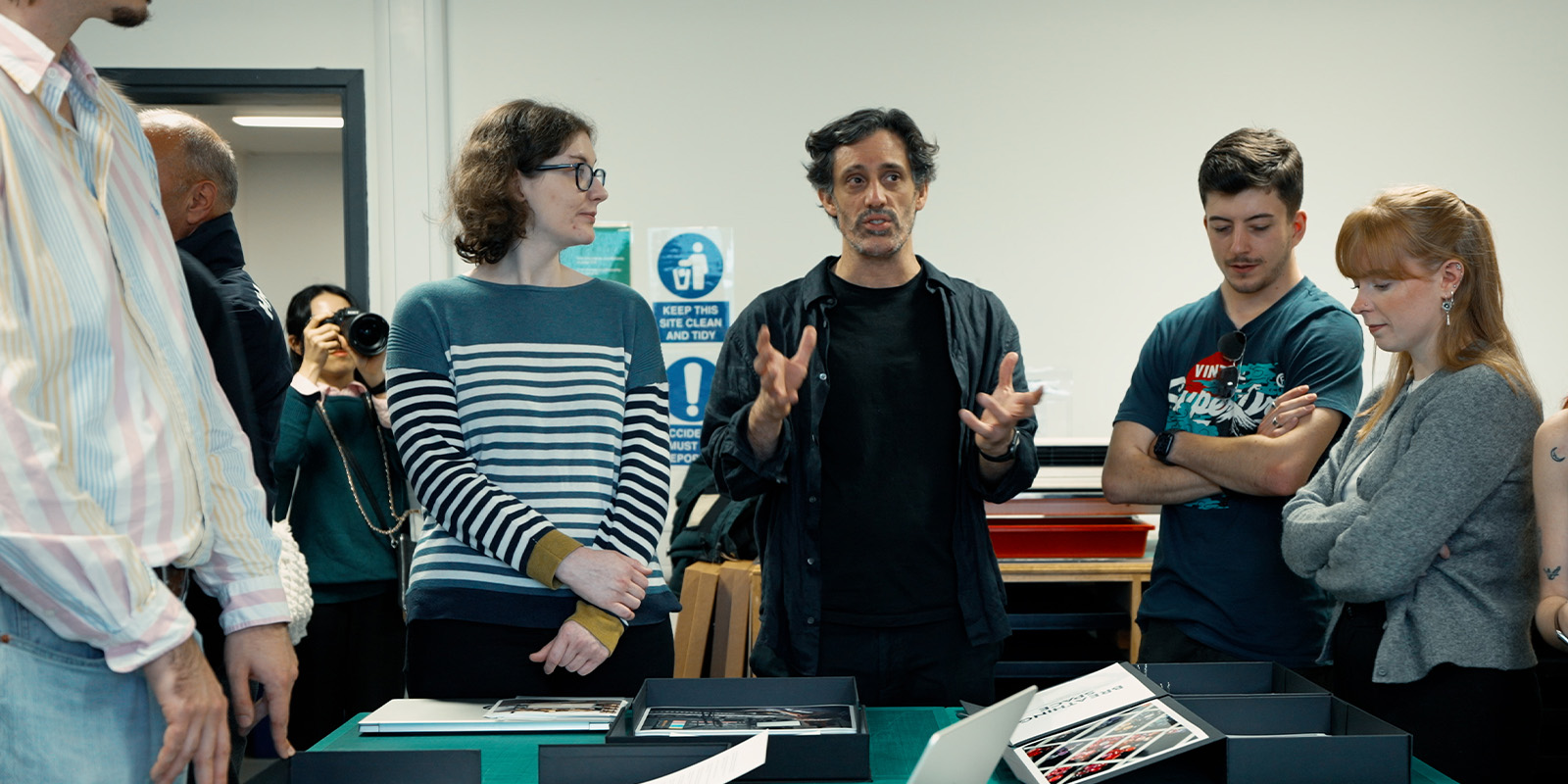 A person talking to a group of students