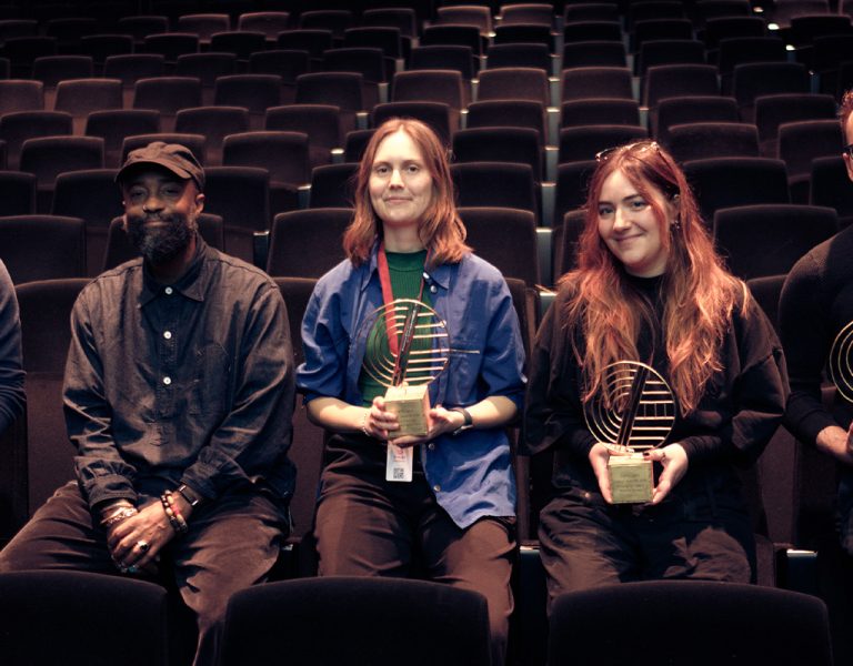 The 2026 winners with Jury President, Bradford Young, in a cinema
