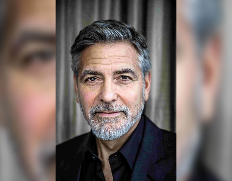 George Clooney looking into camera