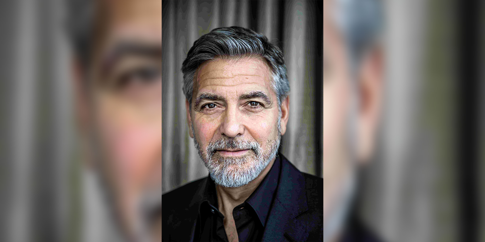 George Clooney looking into camera