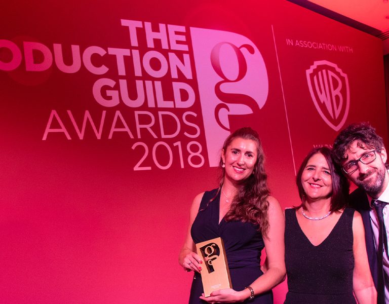 People posing at the Production Guild Awards
