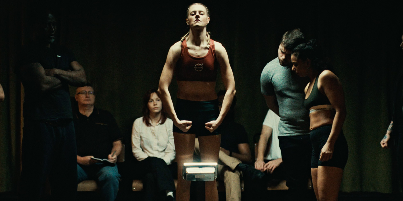A group of people at an MMA weigh-in