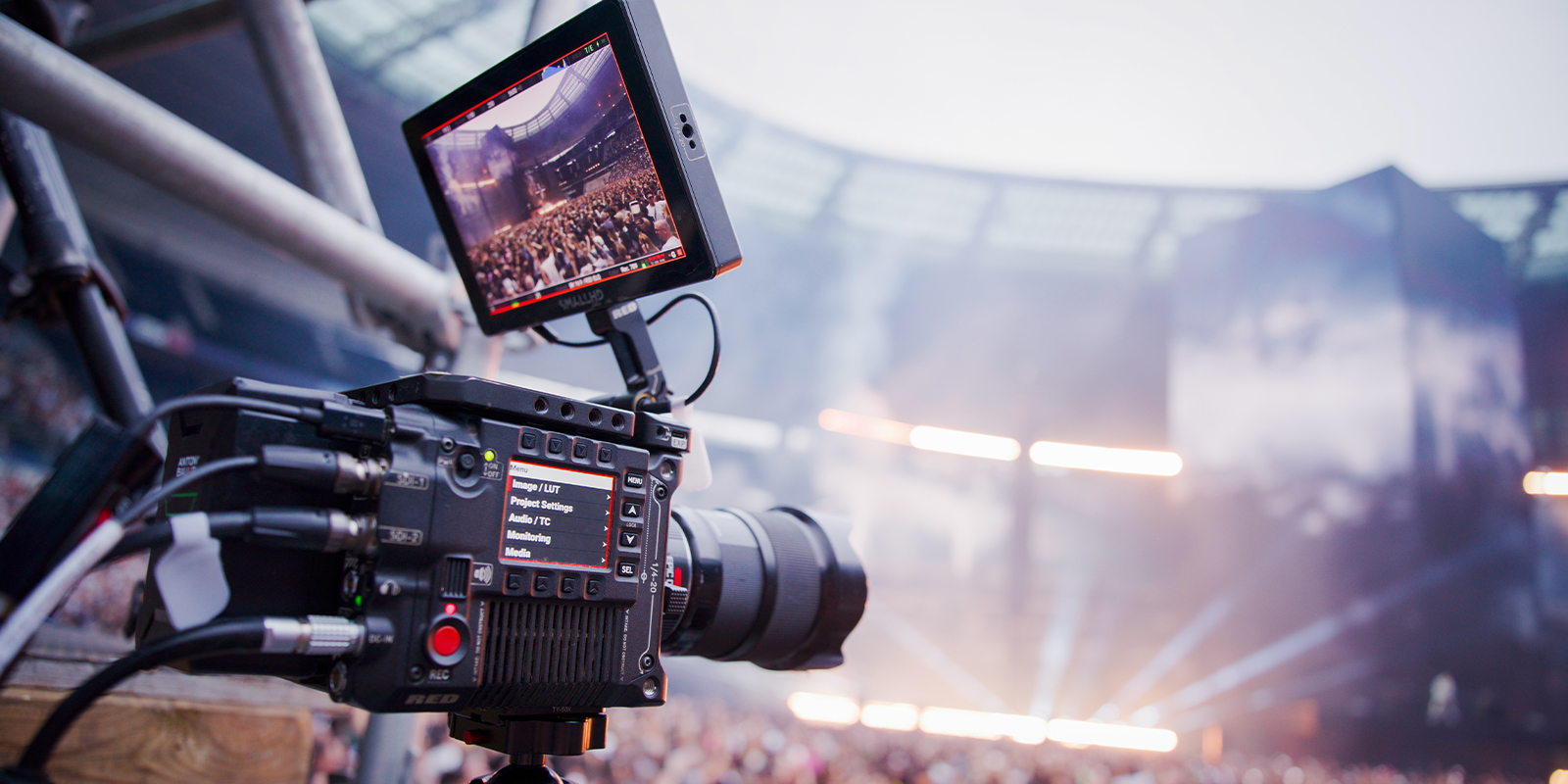 A camera recording a large crowd