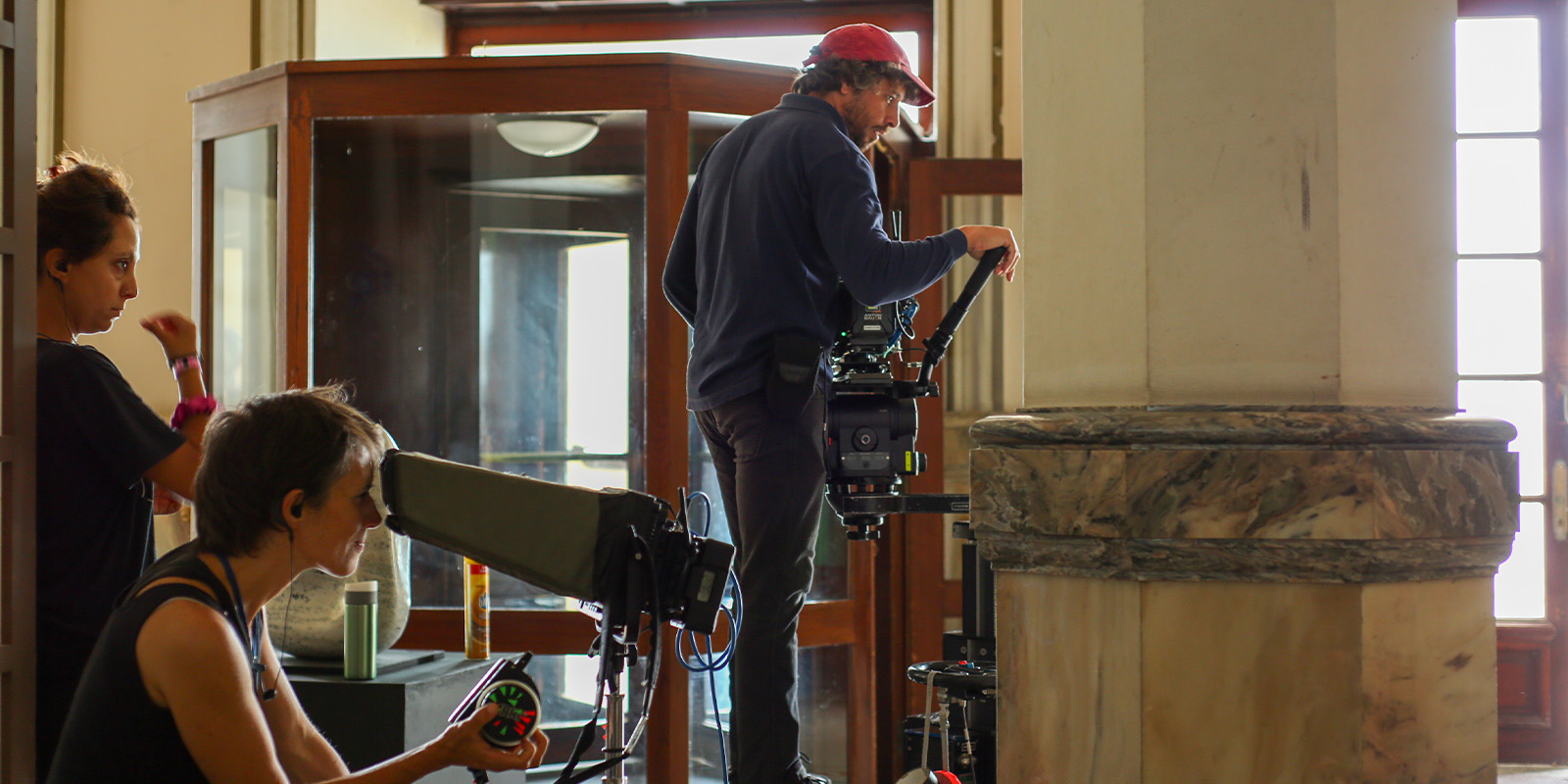Film crew on set in a historic building