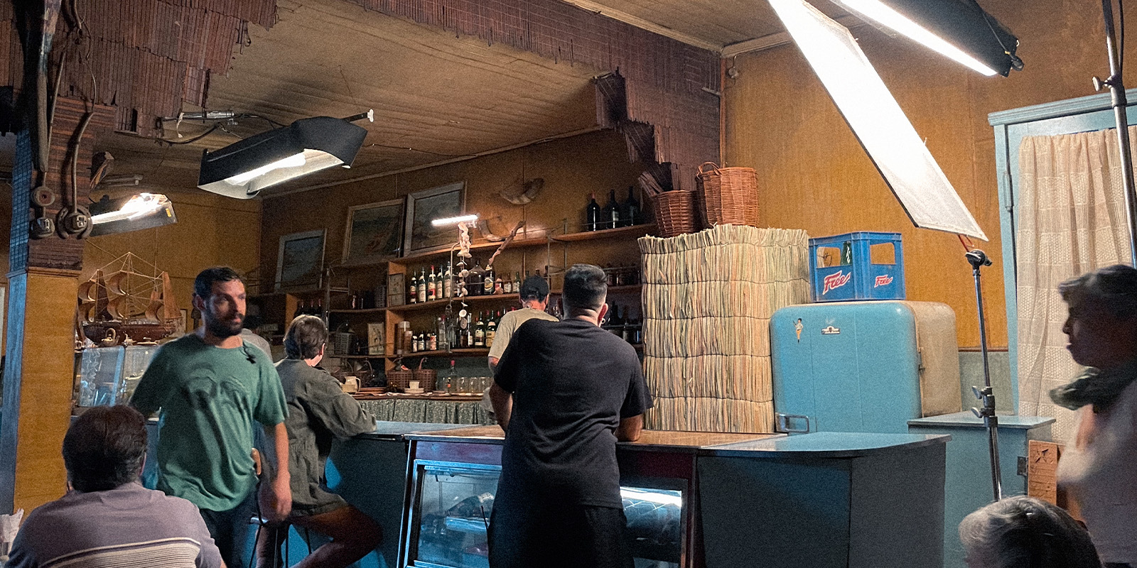 Film crew on set with large lights
